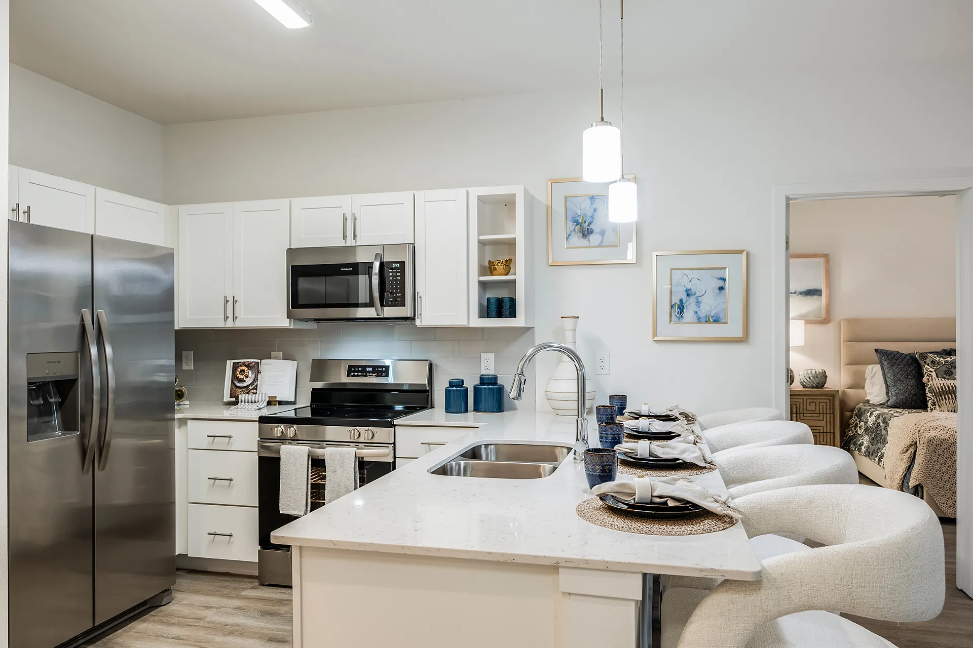 Apartment kitchen with bar chairs