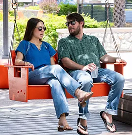 couple sitting on a swing